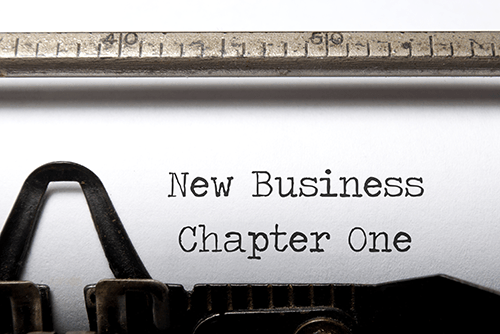 Typewriter typing New Business Chapter One
