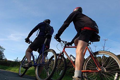 Two people cycling