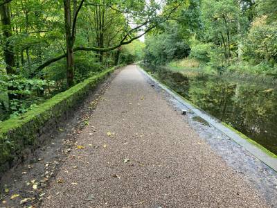 Huddersfield Narrow Canal path covered in mud.