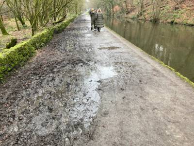 Huddersfield Narrow Canal path covered in mud.