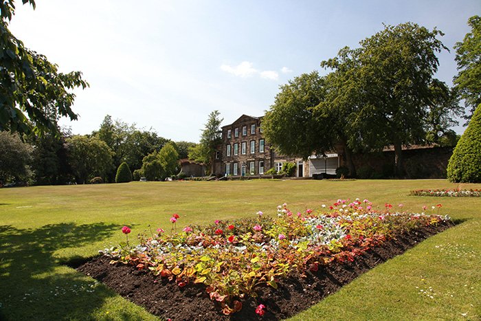 View across the lawn towards the big house in the park