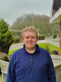 Pictured here: Kyle outside Cedar Court, Huddersfield