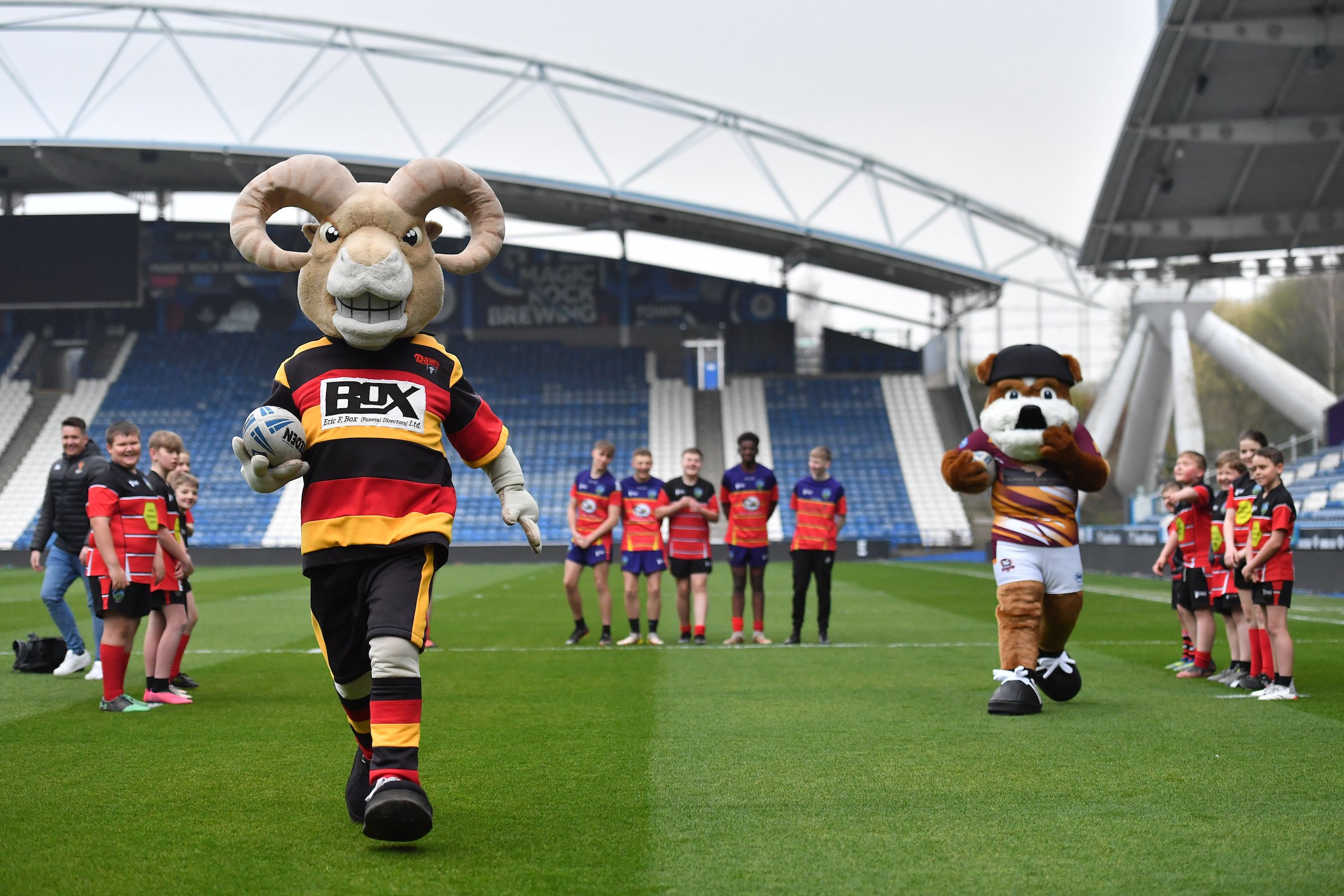 Children and mascots on a football field