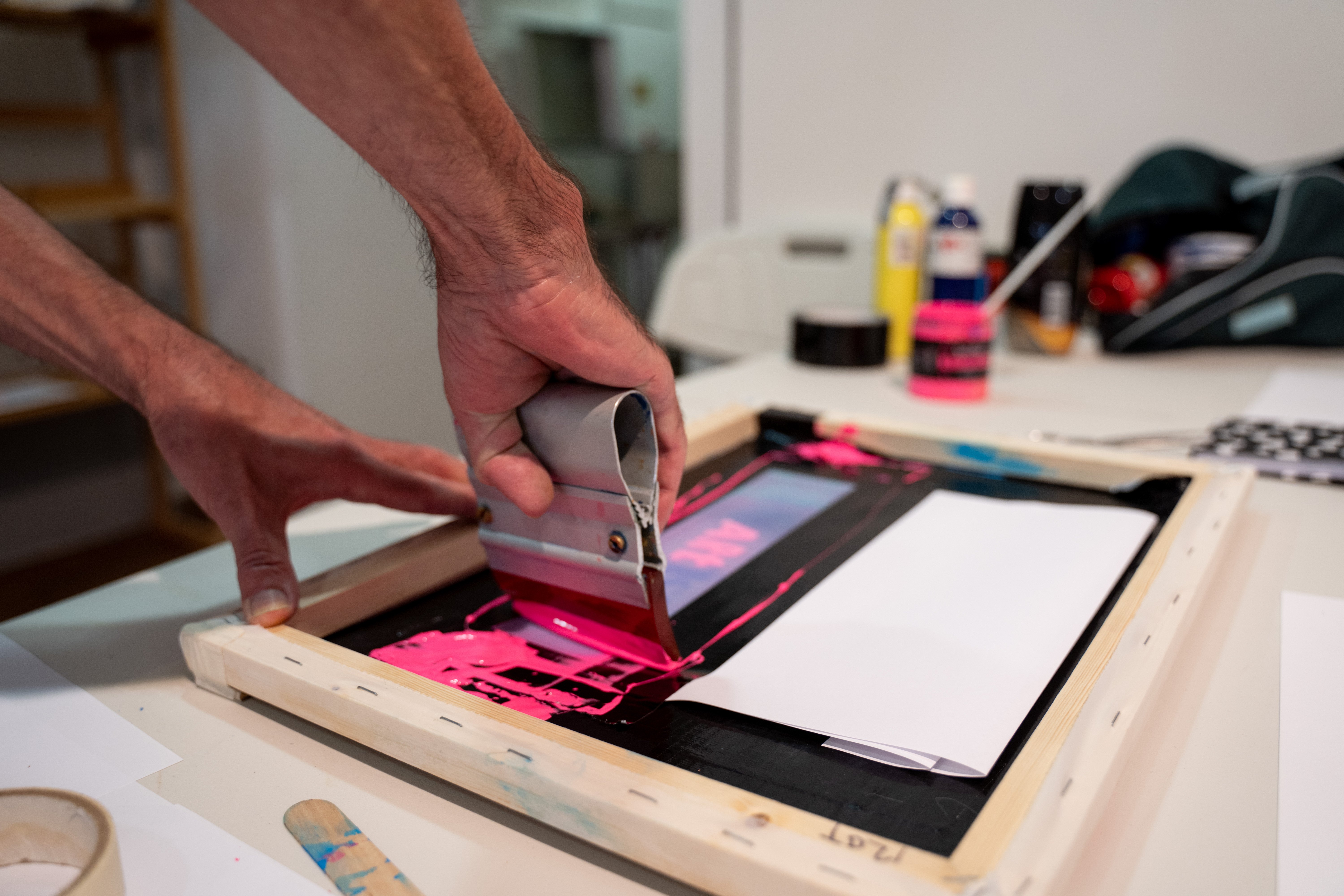 A person using a screen press
