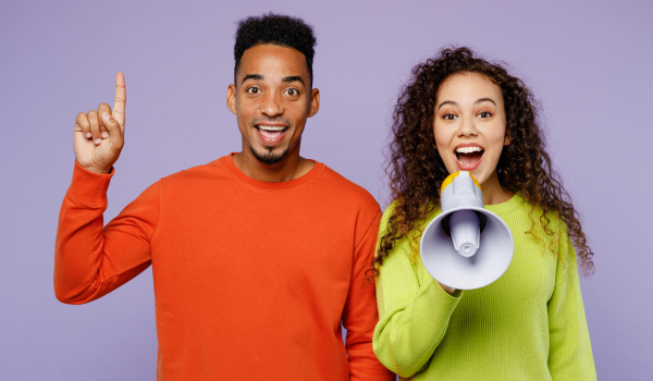 Two foster carers stood next to each other smiling