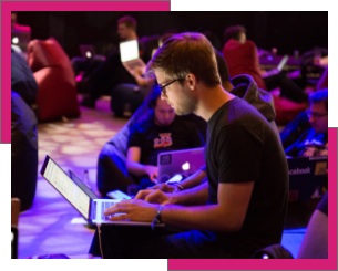 Supporting image of a person sat at a computer