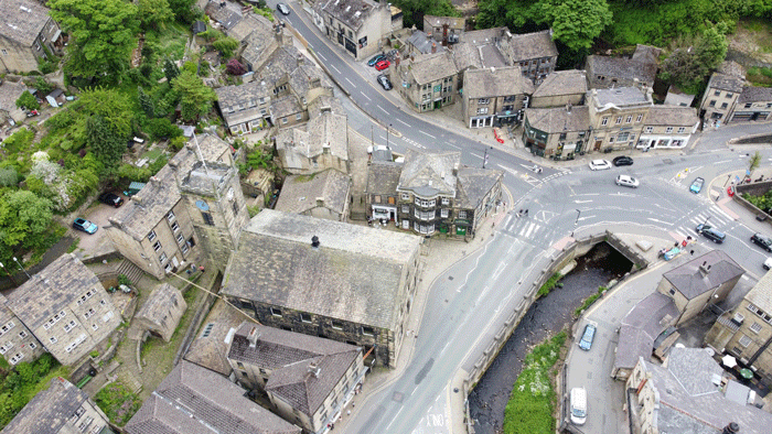 Aerial view of the River Holme passing between Holmfirth streets