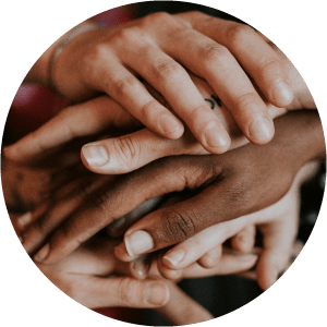 A cluster of hands on top of each other