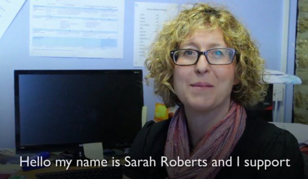 Woman sat at her desk