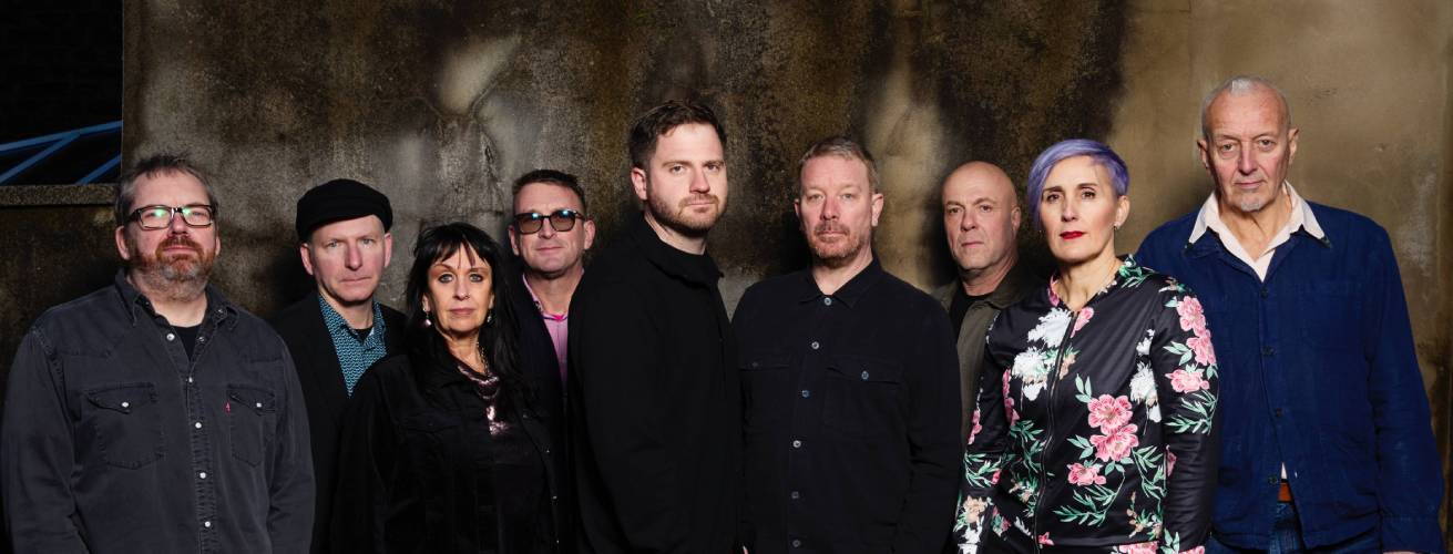 A musician with light shining on her