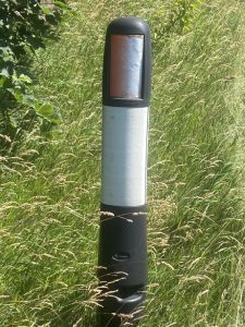 Black and white moorland marker post bollard