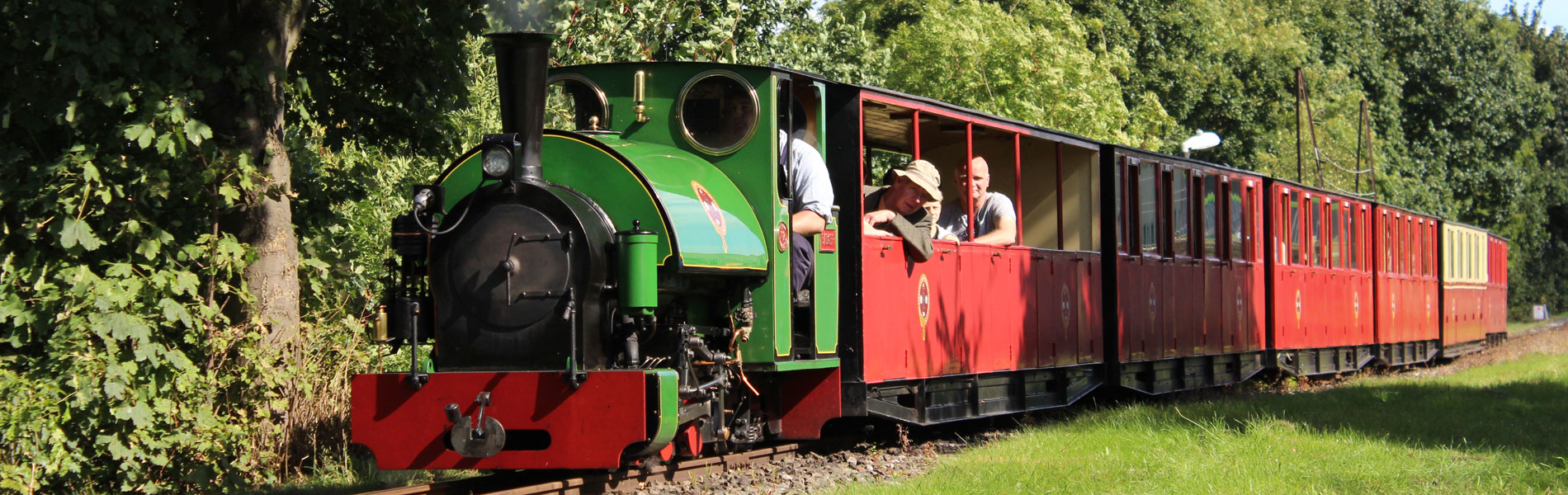 People riding on a steam train