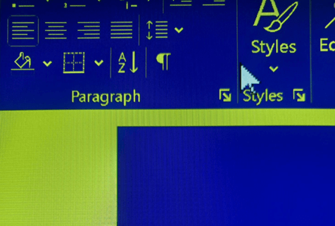 Photo of the pink text which had poor colour contrast no longer visible at all when using assistive software because the colour was too light on a light background.