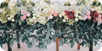 A photo of wedding flowers in a line